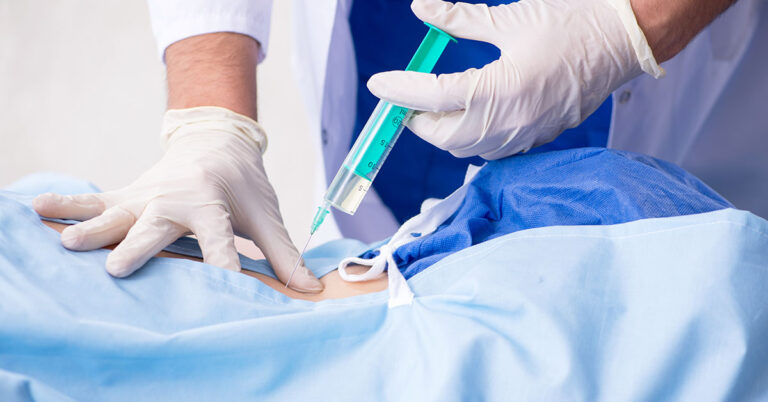 Female patient getting an injection in the clinic